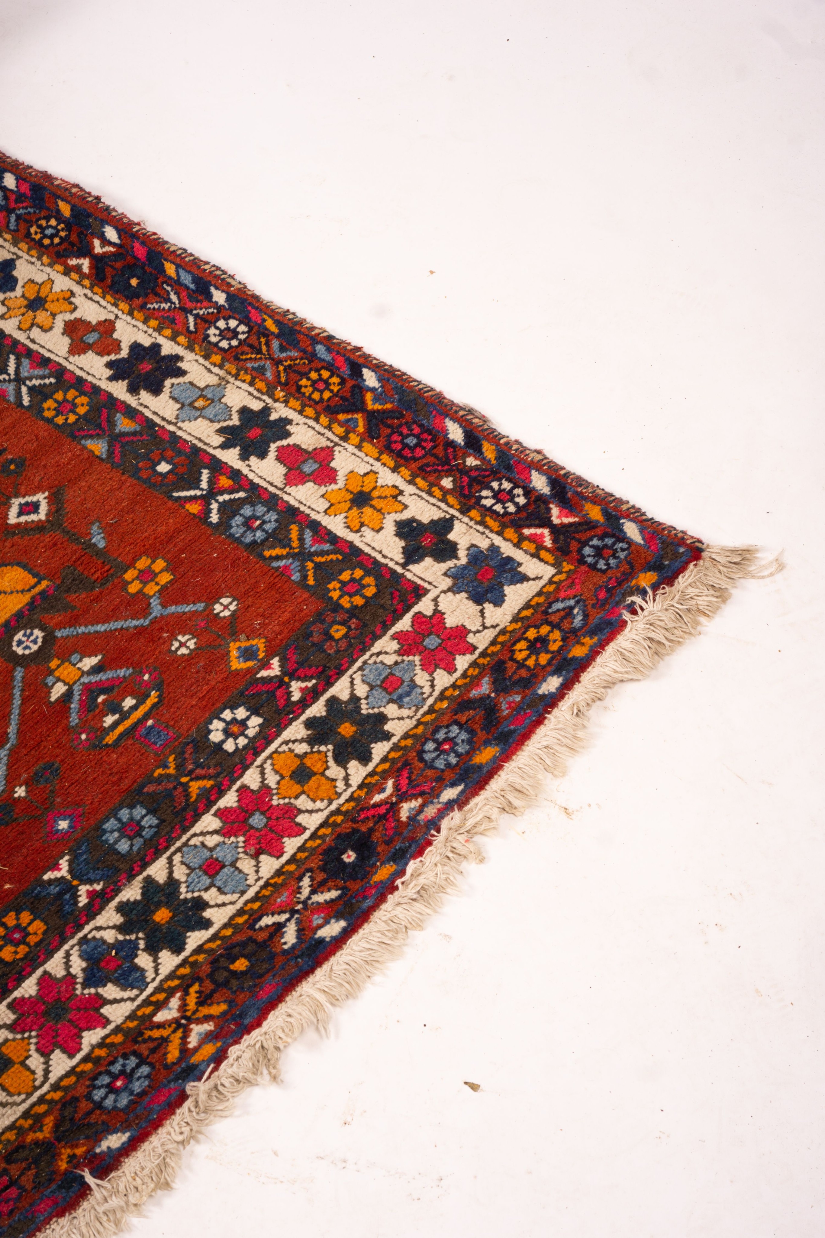 A Turkish red ground rug, 190 x 152cm